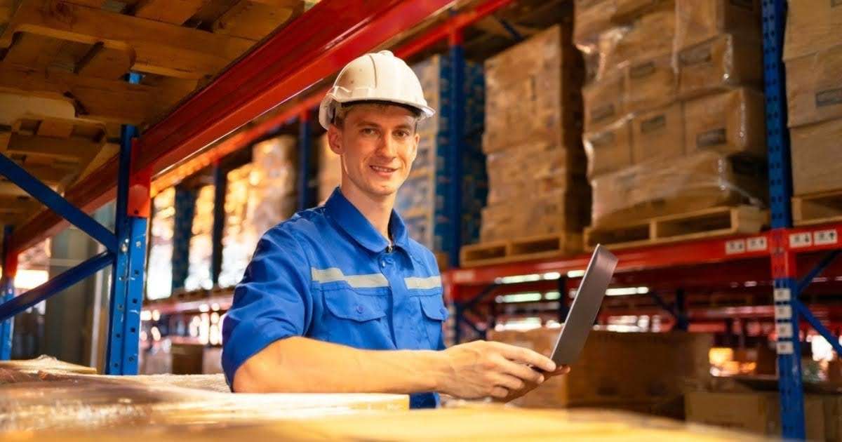 A Phoenix storage professional standing with a tablet in a storage facility