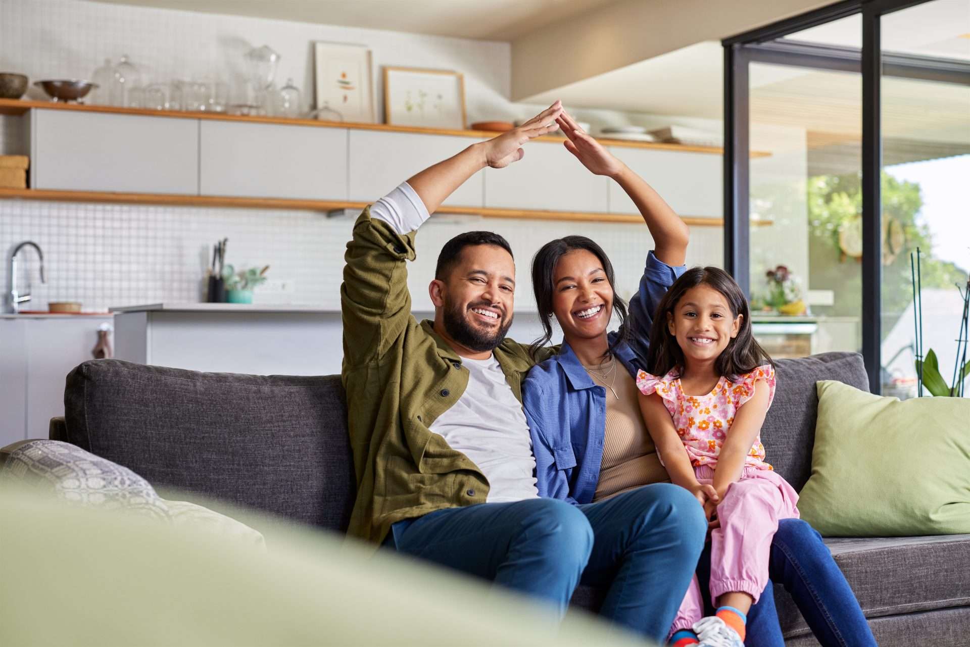 Happy family relaxing at home in Phoenix, Arizona, enjoying peace of mind thanks to Muscular Moving Men’s reliable packout services in Phoenix.
