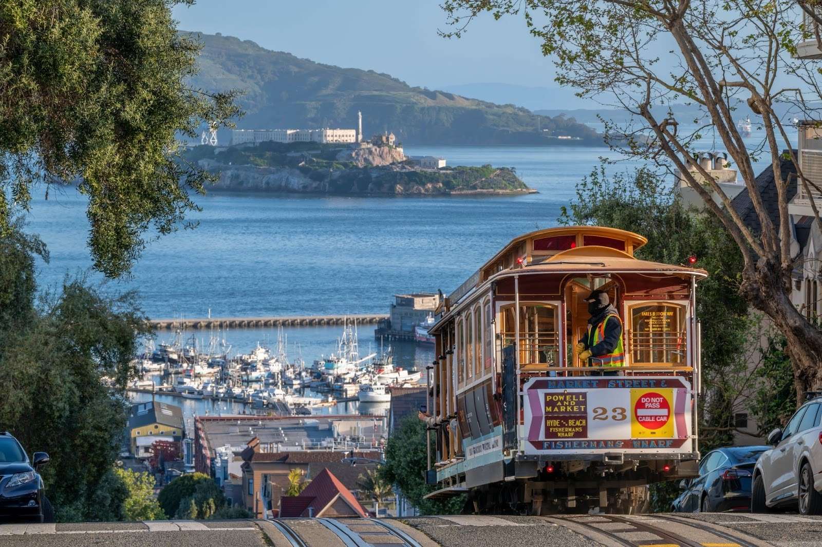 Iconic San Francisco cable car driving down a hill