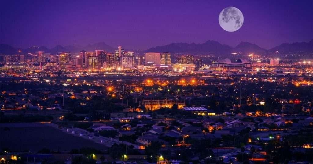 Phoenix Arizona Skyline at Night. Full Moon Over Phoenix, Arizona, United States.