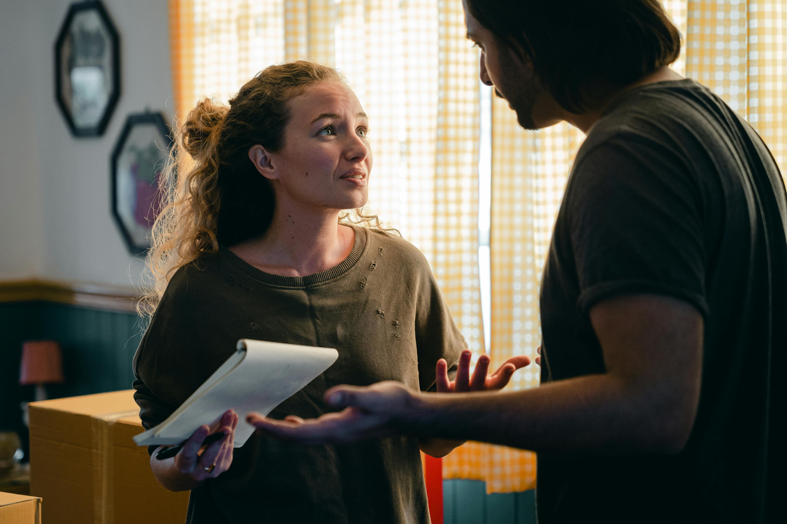 Young couple looking frustrated as they prepare for a move